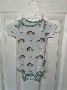 Kyte Baby White Onesie with Sage Green Trim and Hedgehog Motif